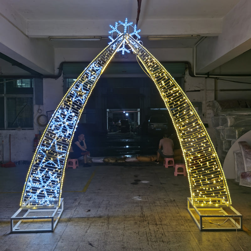 This is an oversized pre-lit walk-through snowflake arch decoration with LEDs for outdoor commercial projects. Picture of Certified Lights&