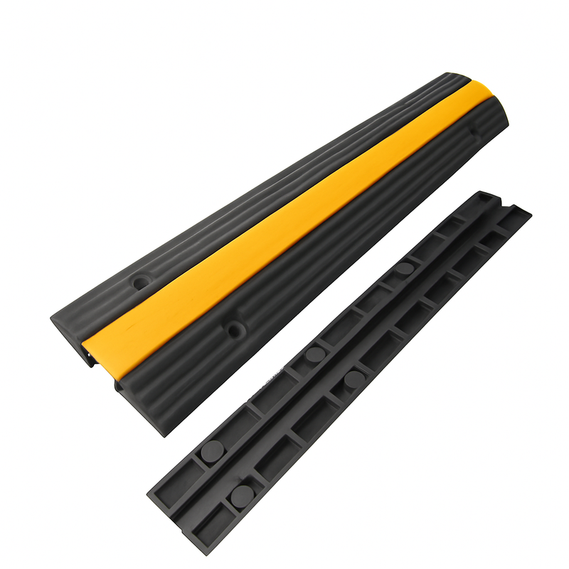 Heavy-duty cord protector for floor cable management, black body with yellow center strip, suitable for outdoor or high traffic area.